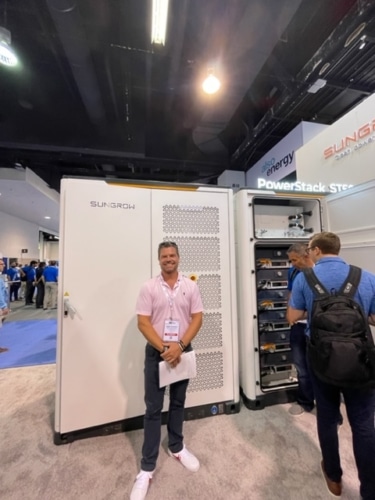 Large Businesses Can Save Hundreds Of Thousands Of Dollars By Installing Commercial Solar Battery Storage! Pictured here is BCSC Founder James Kennedy at RE+ in Anaheim, CA with a Sungrow Commercial Battery 